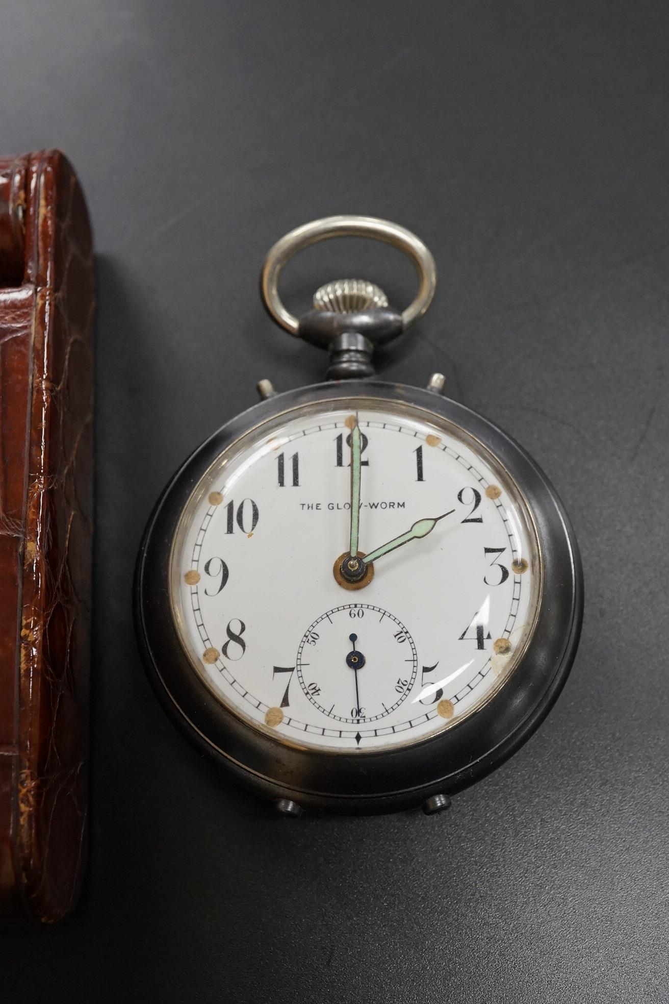 A Finnegan's leather cased travelling timepiece and a base metal Glow Worm pocket watch.